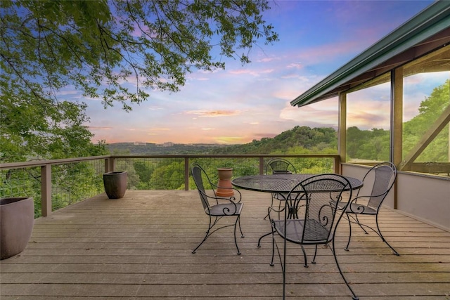 wooden deck featuring outdoor dining area