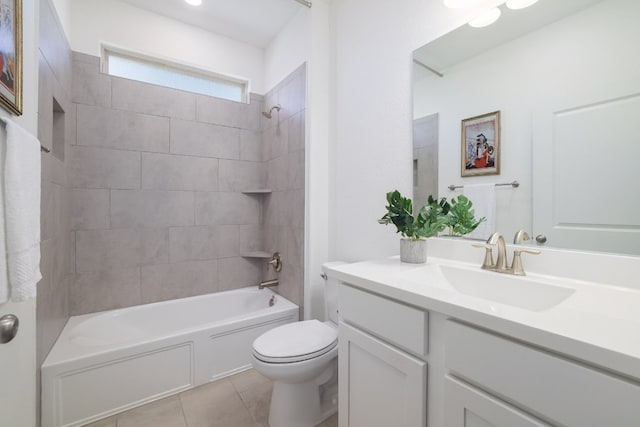 bathroom featuring tile patterned flooring, tub / shower combination, vanity, and toilet