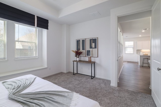 carpeted bedroom featuring recessed lighting and baseboards