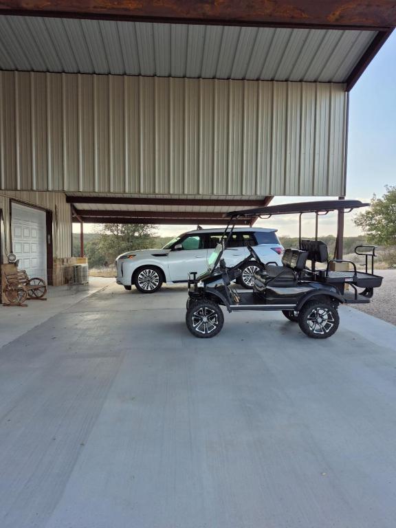 garage featuring a carport