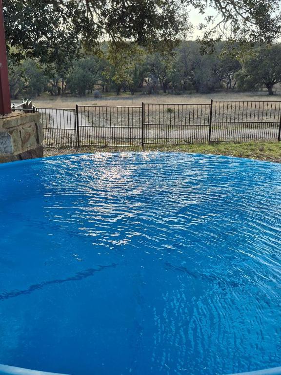 view of swimming pool with fence