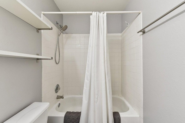 bathroom featuring toilet and shower / bathtub combination with curtain