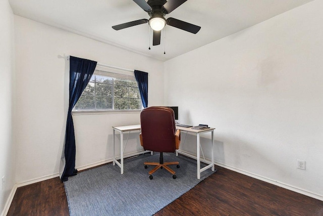 office space featuring wood finished floors, a ceiling fan, and baseboards