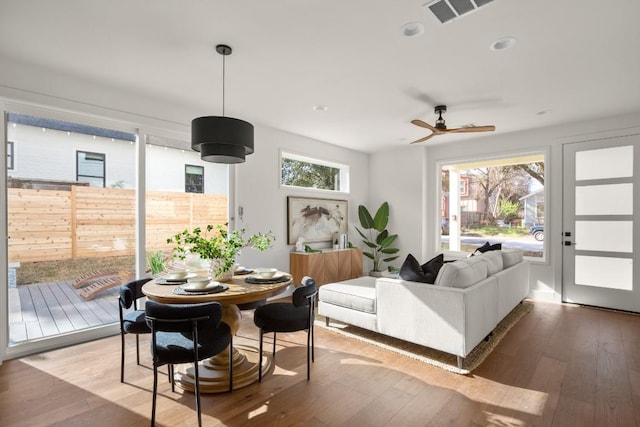 interior space with hardwood / wood-style flooring, visible vents, and a wealth of natural light