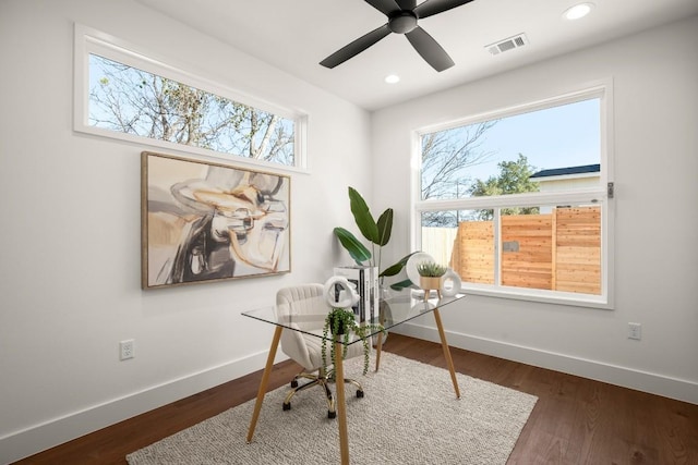 office space featuring plenty of natural light, baseboards, and visible vents