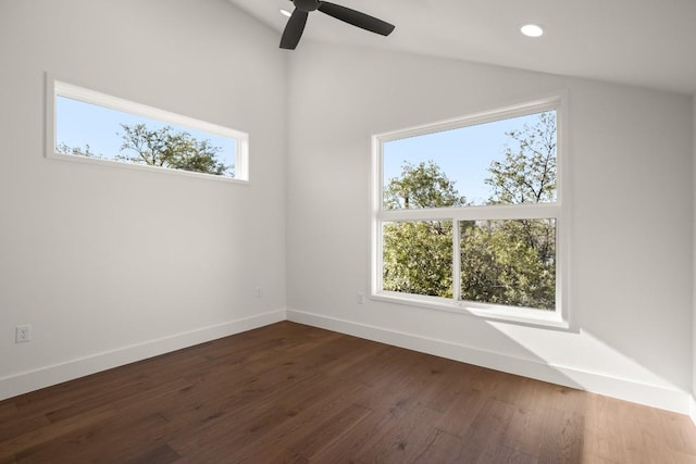 empty room with baseboards, lofted ceiling, recessed lighting, dark wood-style floors, and a ceiling fan