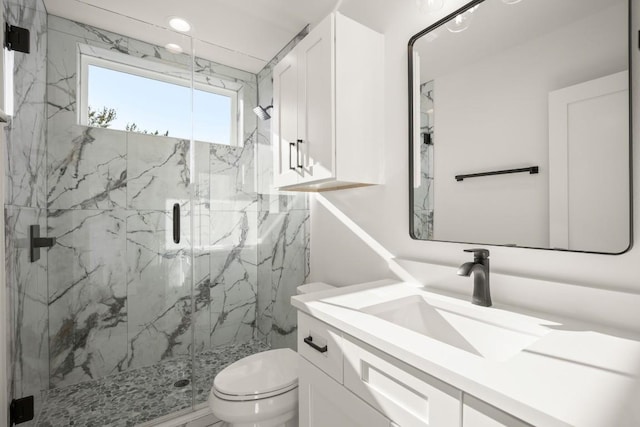 bathroom with vanity, toilet, recessed lighting, and a marble finish shower