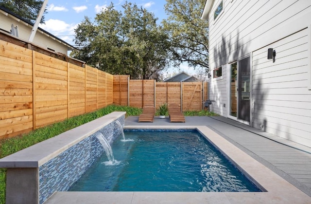 view of swimming pool with a fenced in pool and a fenced backyard