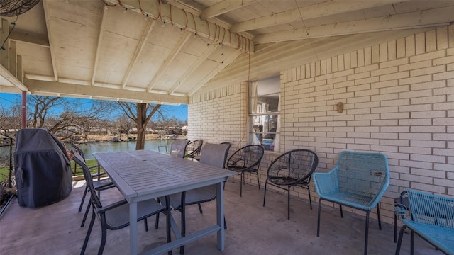 view of patio / terrace with outdoor dining space and grilling area