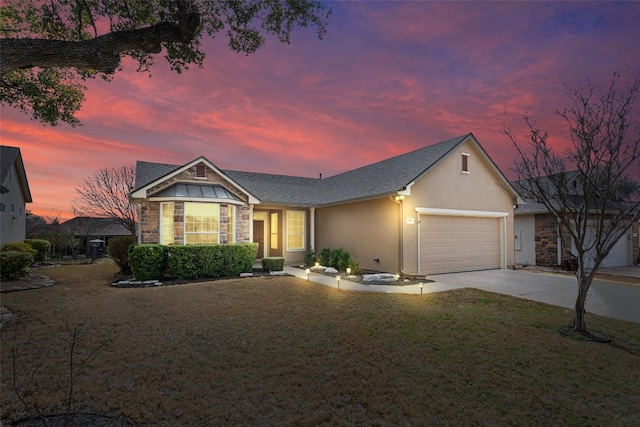 ranch-style house featuring concrete driveway, a lawn, stucco siding, a garage, and stone siding