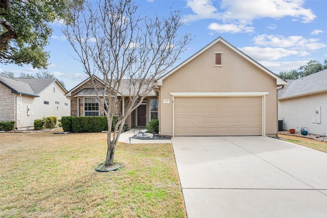 single story home with stucco siding, an attached garage, concrete driveway, and a front yard