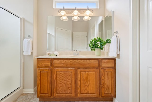 bathroom featuring vanity and an enclosed shower