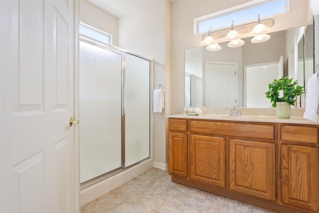 full bathroom featuring a stall shower and vanity