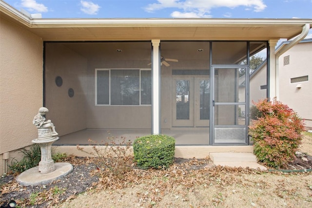 property entrance featuring stucco siding