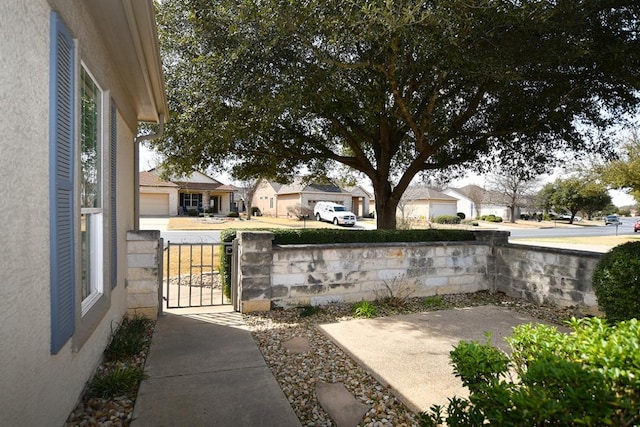 715 Texas Dr, Georgetown, TX 78633 - view of yard featuring a gate and a residential view