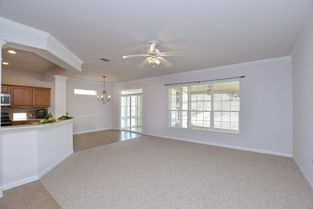 interior space featuring light carpet, light tile patterned floors, ornamental molding, ornate columns, and ceiling fan with notable chandelier