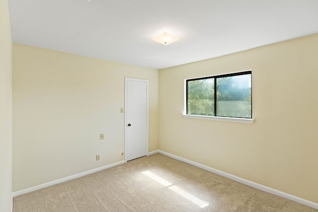 7701 Penelope Cir, Austin, TX 78759 - spare room featuring baseboards and carpet flooring