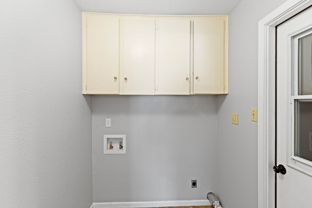 7701 Penelope Cir, Austin, TX 78759 - laundry room with washer hookup, cabinet space, and hookup for an electric dryer