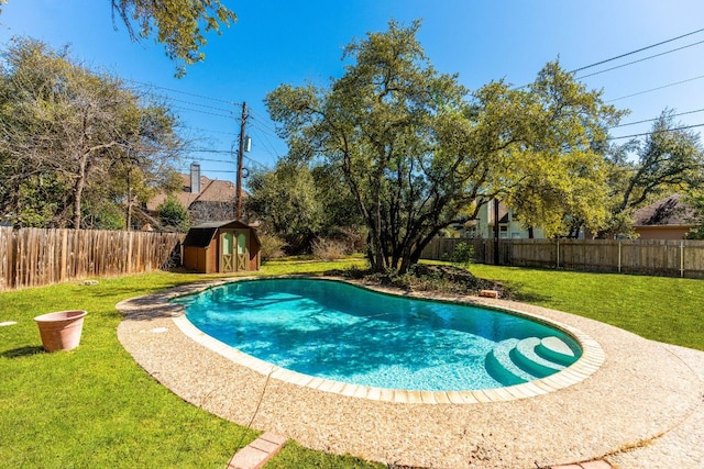 7701 Penelope Cir, Austin, TX 78759 - view of swimming pool with a fenced in pool, a fenced backyard, a yard, an outdoor structure, and a shed