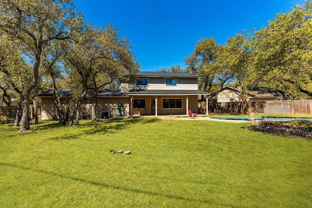 7701 Penelope Cir, Austin, TX 78759 - rear view of property with a patio, a lawn, fence, and a fenced in pool