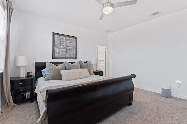 bedroom with ceiling fan, carpet, visible vents, and baseboards