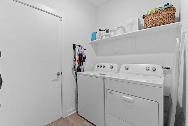 457 Agave Azul Way, Leander, TX 78641 - laundry area featuring washing machine and clothes dryer and light wood-type flooring