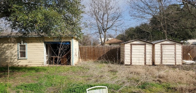 view of shed featuring fence