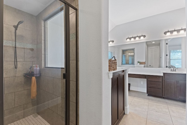 full bath featuring a shower stall, vanity, and tile patterned floors