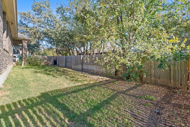 view of yard with a fenced backyard