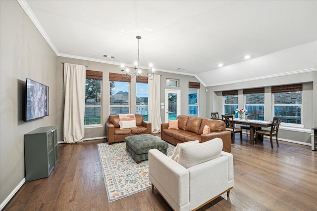 living room with lofted ceiling, crown molding, baseboards, dark wood-style floors, and an inviting chandelier