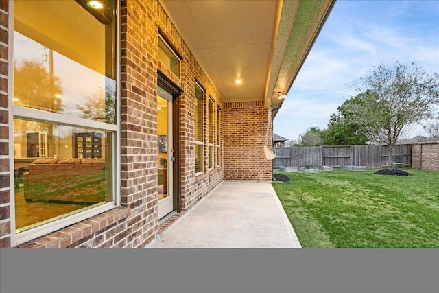 view of patio / terrace featuring fence