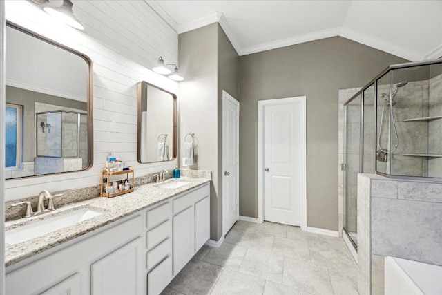 6618 Tiger Trl, Katy, TX 77493 - full bathroom featuring a shower stall, double vanity, crown molding, baseboards, and vaulted ceiling