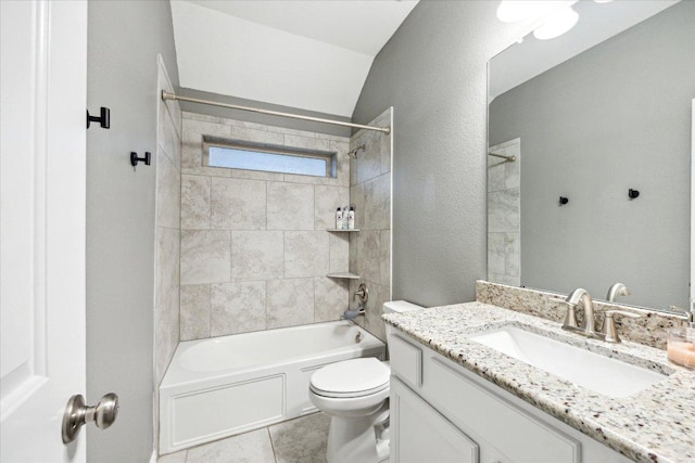 bathroom with a textured wall, tile patterned flooring, toilet, bathing tub / shower combination, and vanity