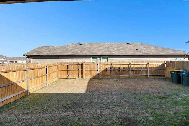 view of yard with a fenced backyard