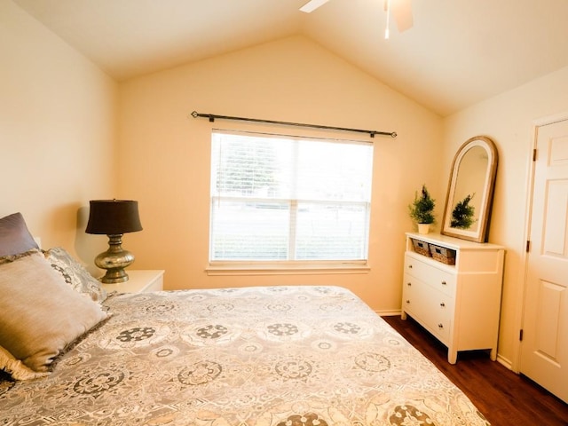 bedroom with a ceiling fan, lofted ceiling, and dark wood-style flooring