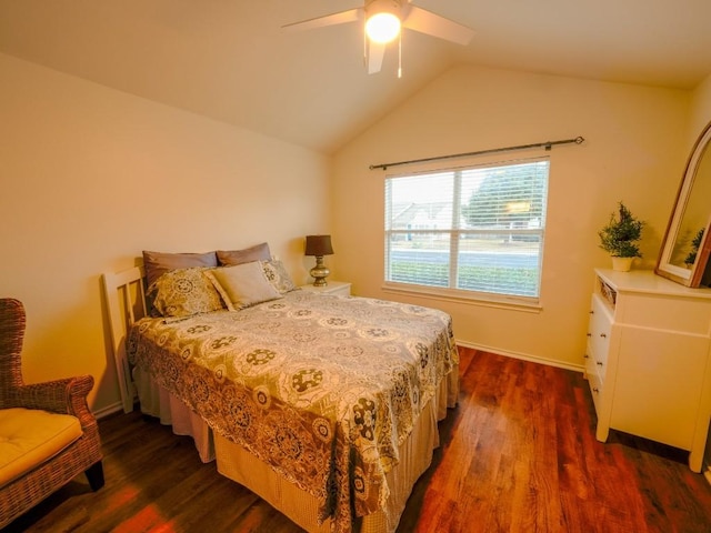 bedroom featuring a ceiling fan, lofted ceiling, dark wood finished floors, and baseboards