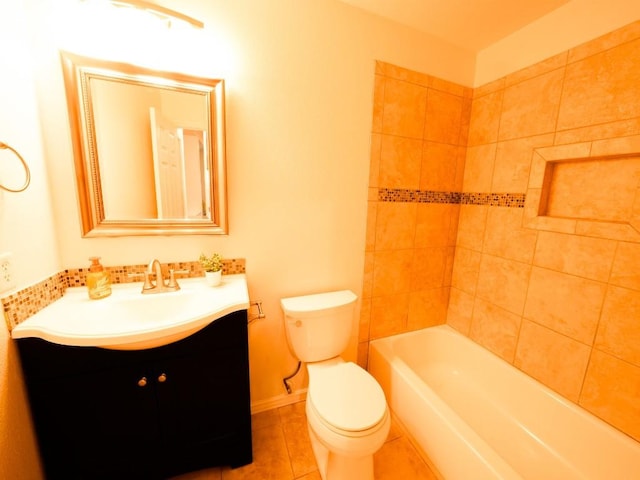 full bath featuring shower / bathing tub combination, toilet, vanity, tile patterned flooring, and baseboards