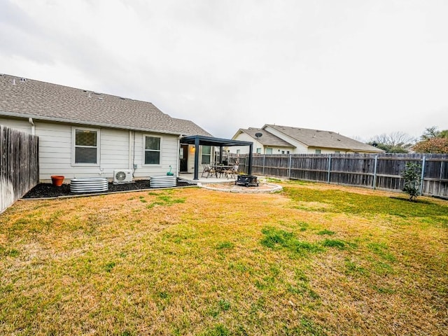 rear view of house featuring a patio area, a fenced backyard, and a yard