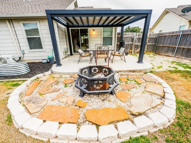 1011 Janae Ct, Georgetown, TX 78626 - view of patio / terrace featuring an outdoor fire pit, a fenced backyard, and a pergola