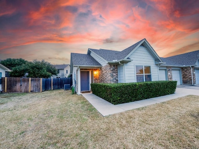 1011 Janae Ct, Georgetown, TX 78626 - ranch-style home featuring a shingled roof, an attached garage, and driveway