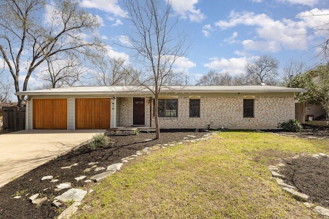 ranch-style home featuring stone siding, concrete driveway, an attached garage, and a front yard