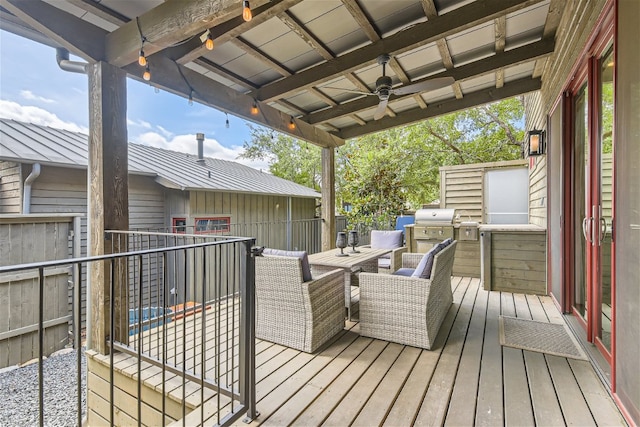 deck featuring area for grilling and a ceiling fan