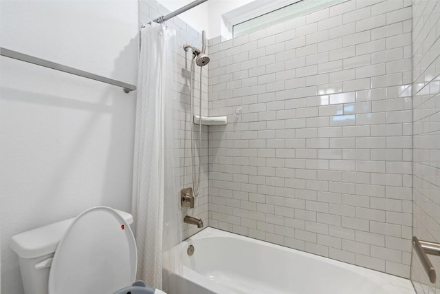 bathroom with shower / tub combo with curtain and toilet