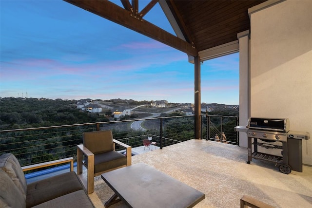 view of patio / terrace with a balcony and a grill