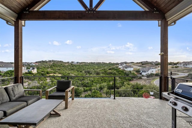 view of patio with grilling area, a balcony, and an outdoor hangout area