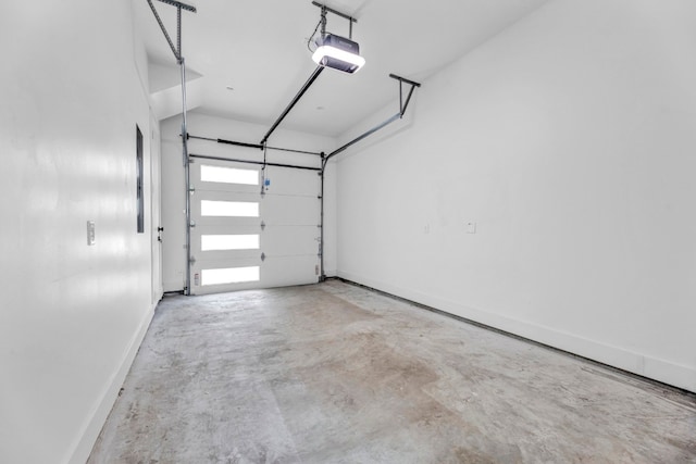 garage featuring baseboards and a garage door opener