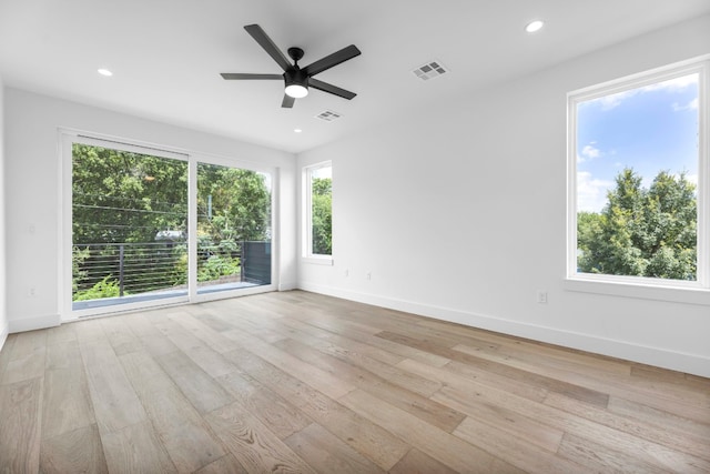 unfurnished room featuring recessed lighting, visible vents, baseboards, and wood finished floors