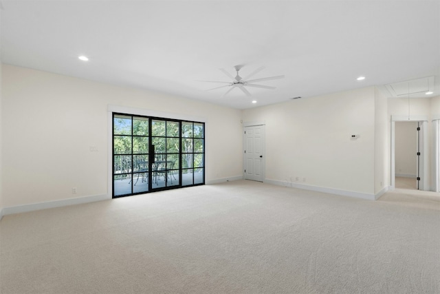 unfurnished room featuring attic access, recessed lighting, light carpet, and baseboards