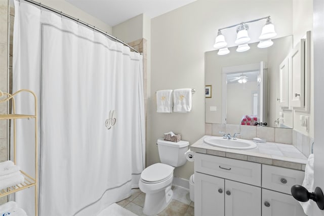 625 Robin Dale Ct, Lakeway, TX 78734 - full bath featuring vanity, tile patterned flooring, a shower with shower curtain, and ceiling fan