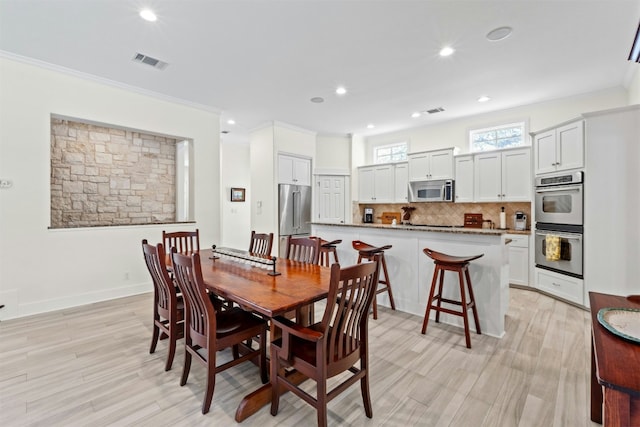 625 Robin Dale Ct, Lakeway, TX 78734 - dining area featuring crown molding, recessed lighting, and light wood finished floors